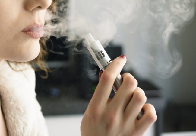 Woman Smoking an E-Cigarette